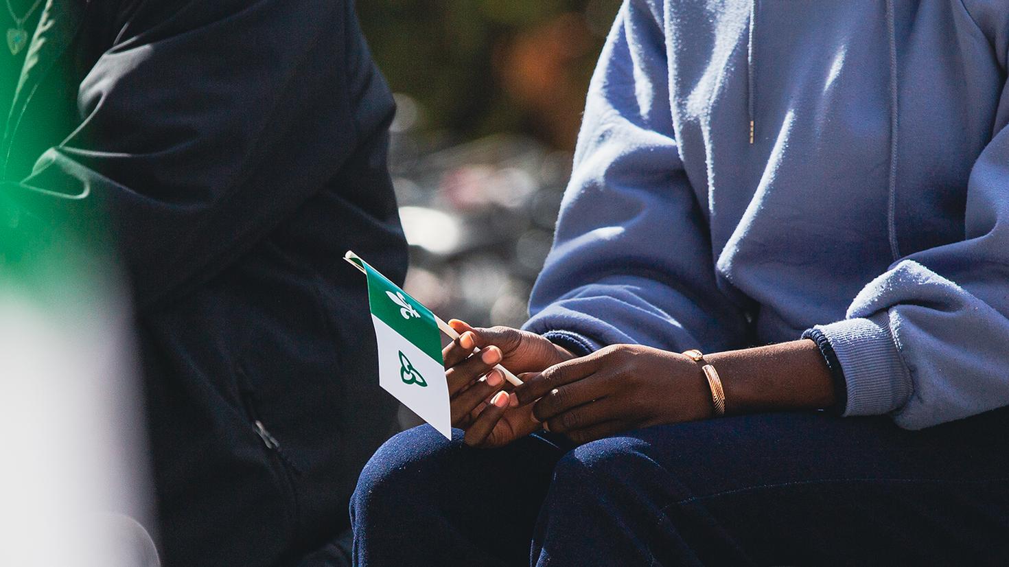 Hand holding the Franco-Ontarian flag