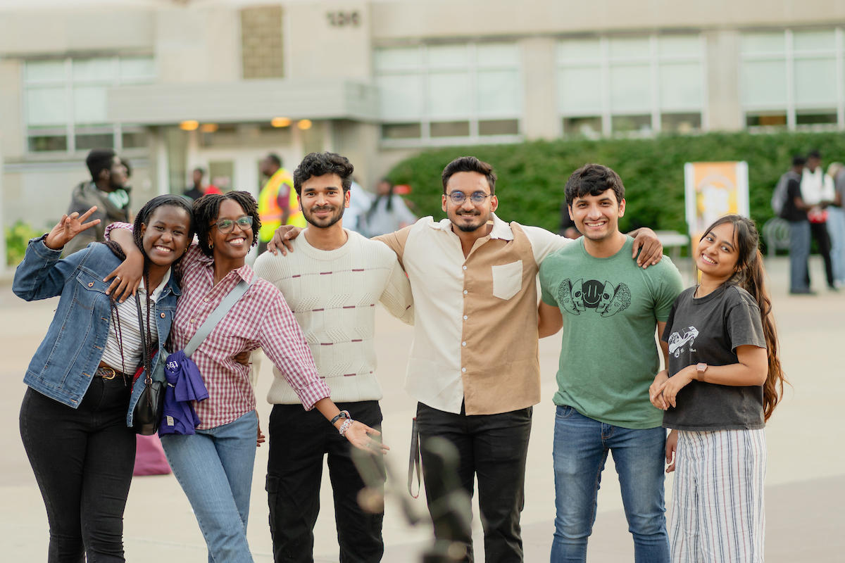 Students smiling at the camera