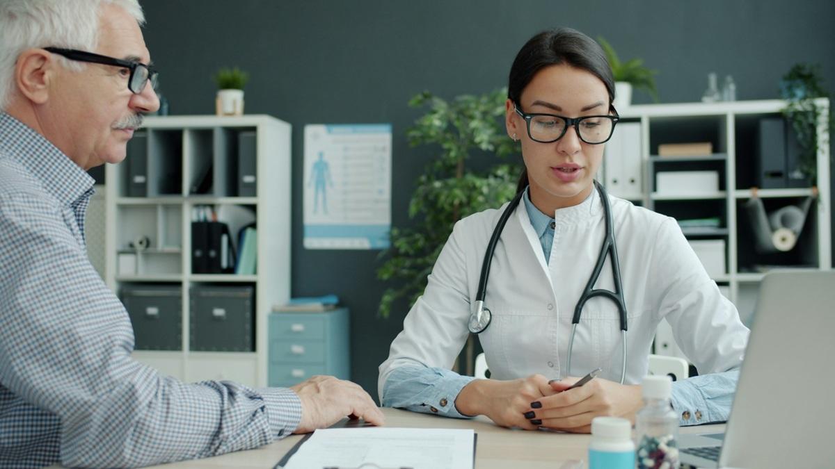 Female doctor with a male patient