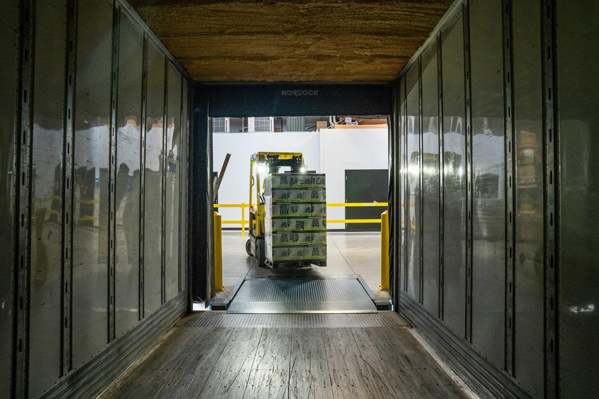 Forklift loading product into shipping container