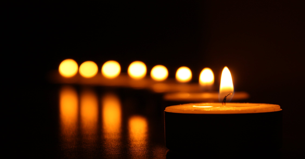 Candles lit in the dark.