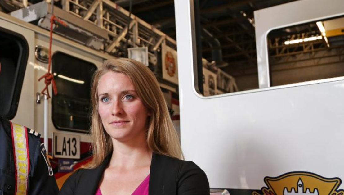 Jennifer Keir standing in front of a fire truck