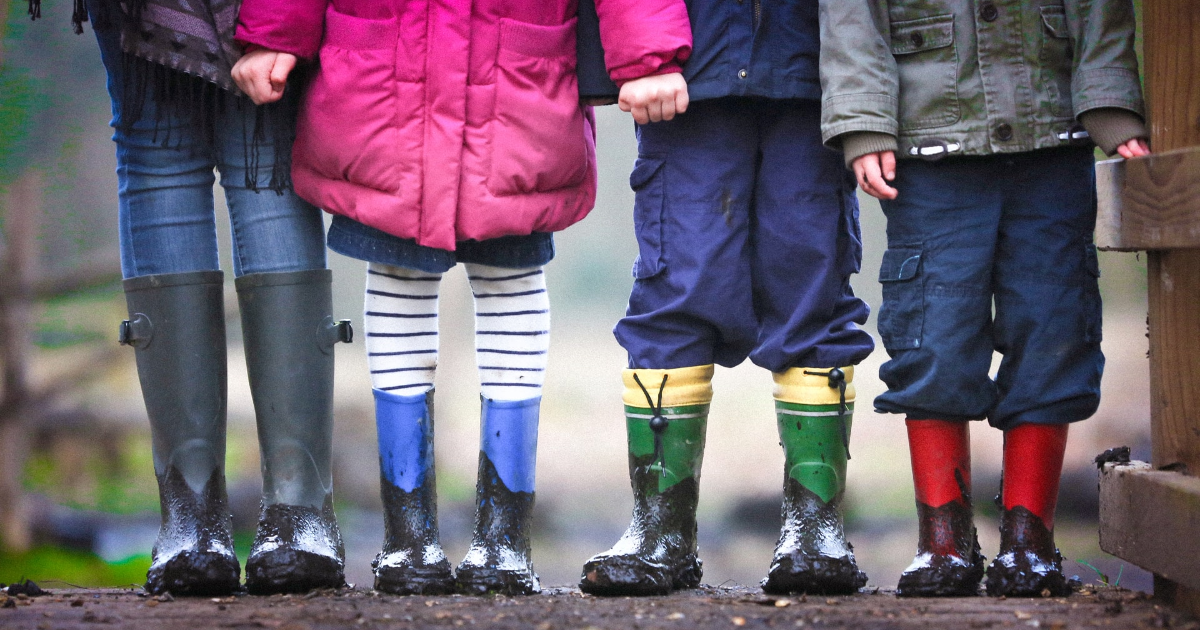 Children's legs with boots on their feet