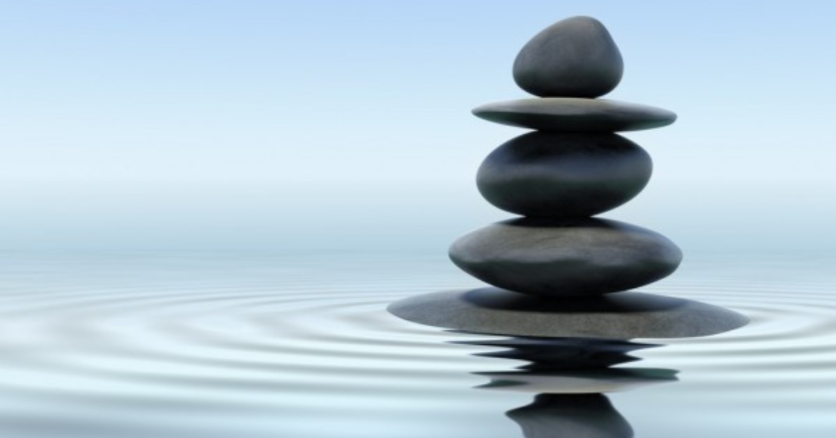 A stone tower on the water
