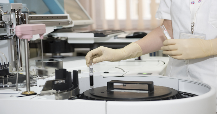 Scientist using a microscope