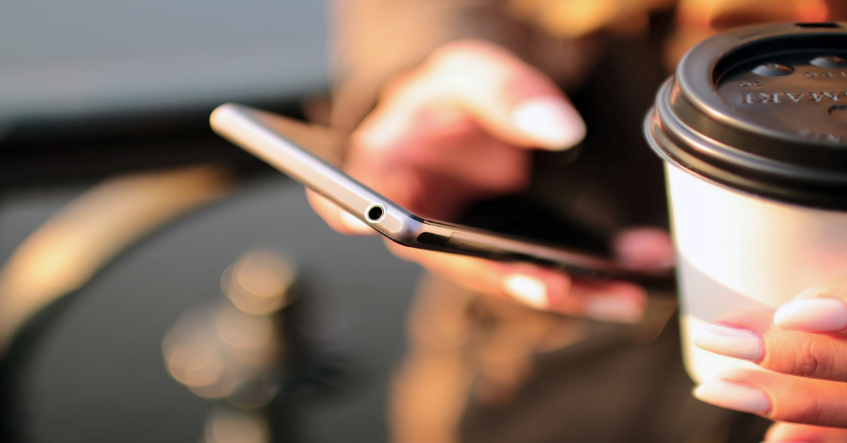 A student looks at her smartphone
