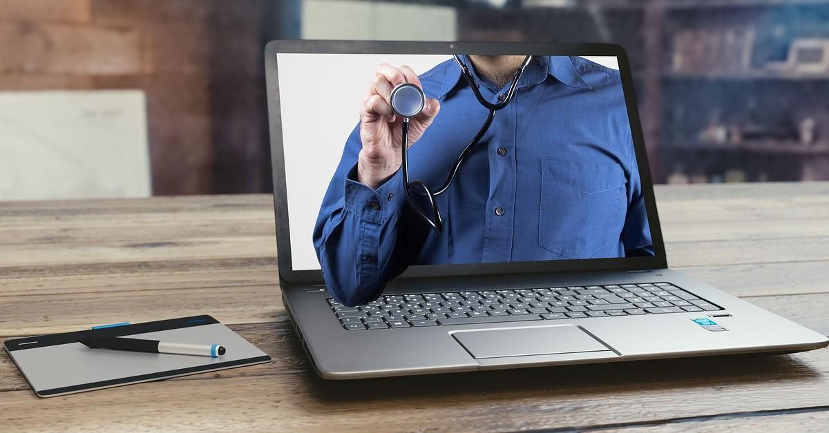 A doctor appearing on a computer screen
