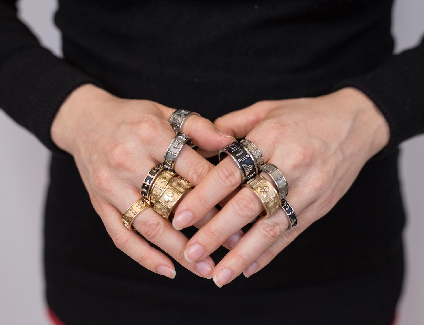 Hands with uOttawa rings on each finger.