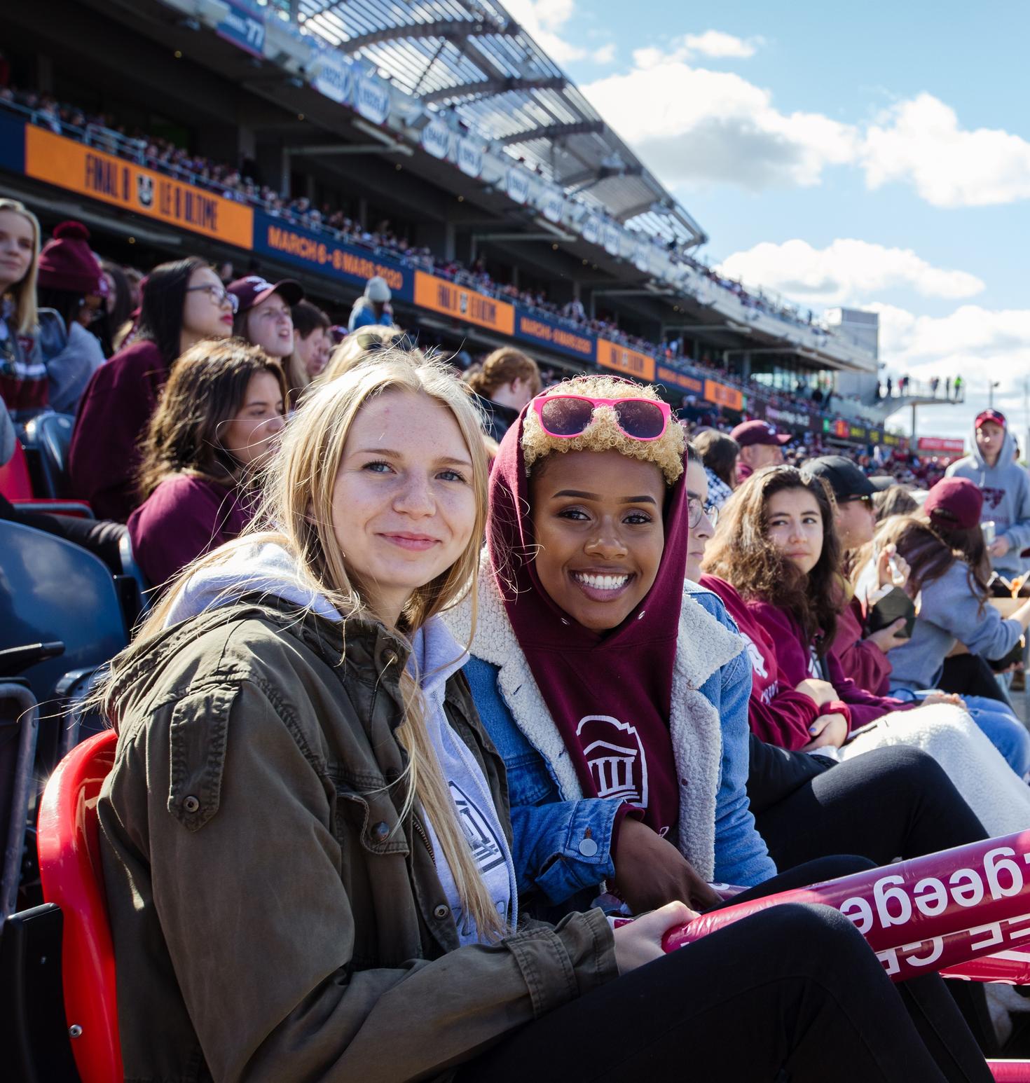 Students sitting in stands at the Panda Games