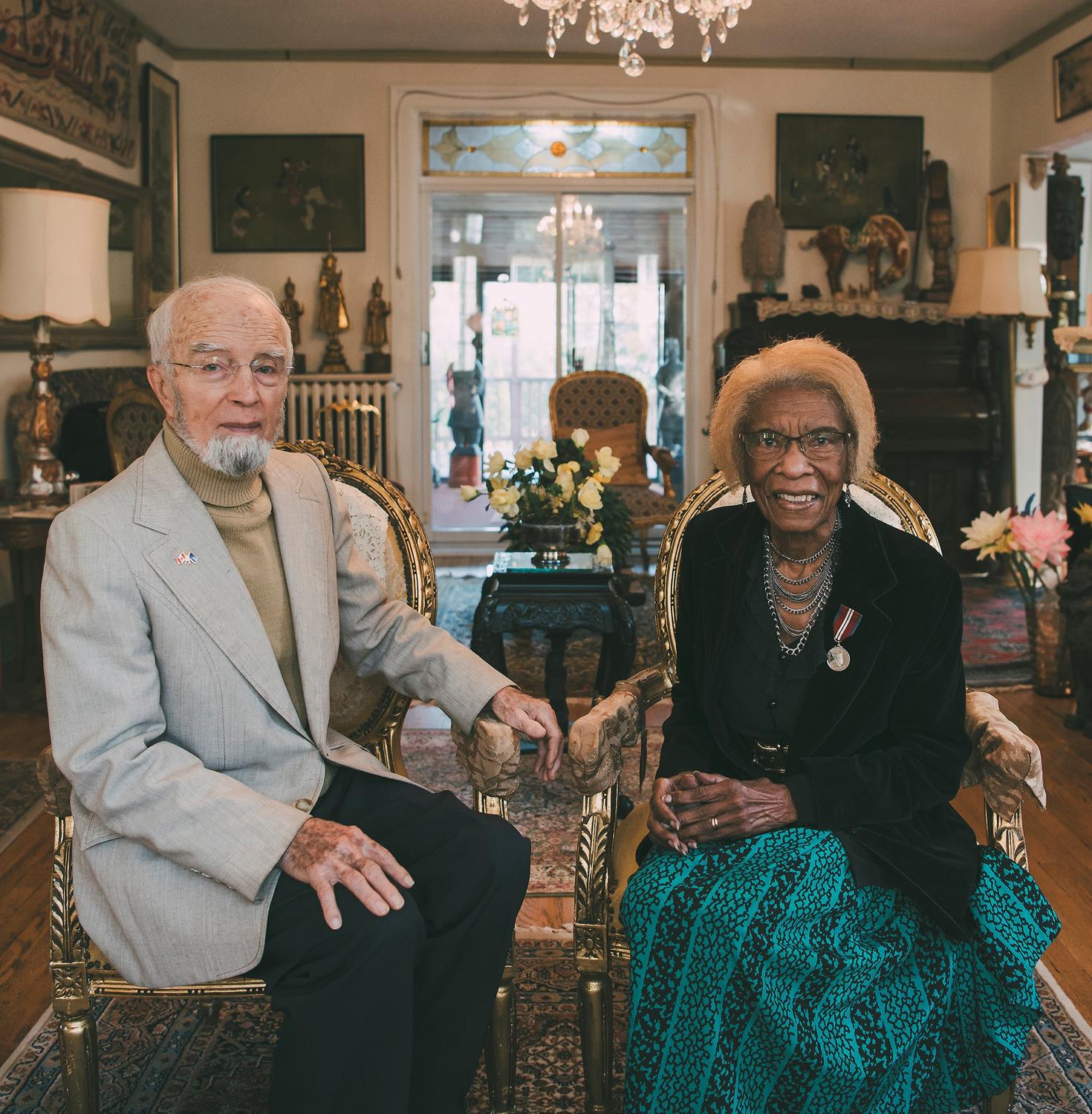 Cynthia and Yves Bled sitting in formal living room.