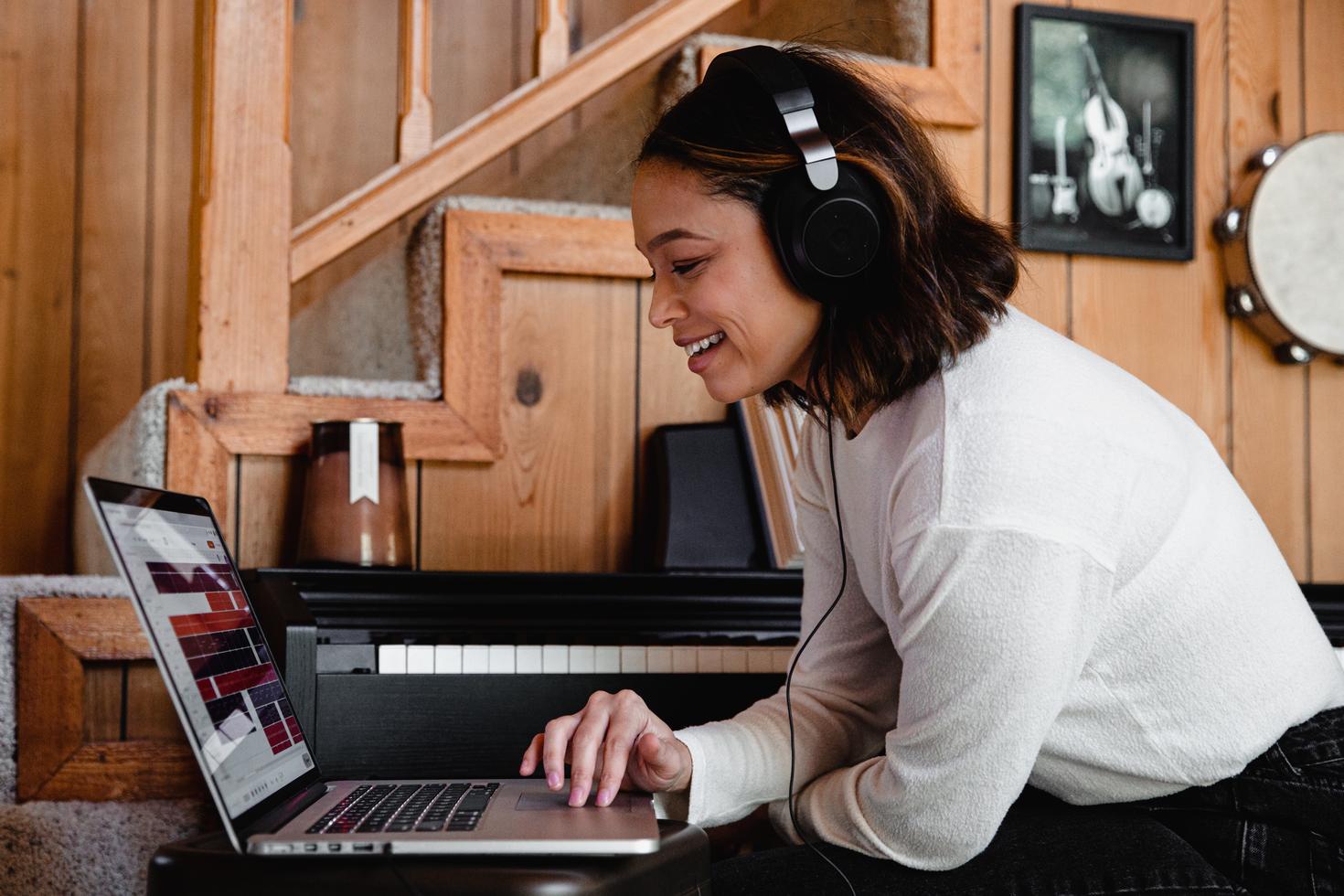 Woman watching a video on laptop with headphones