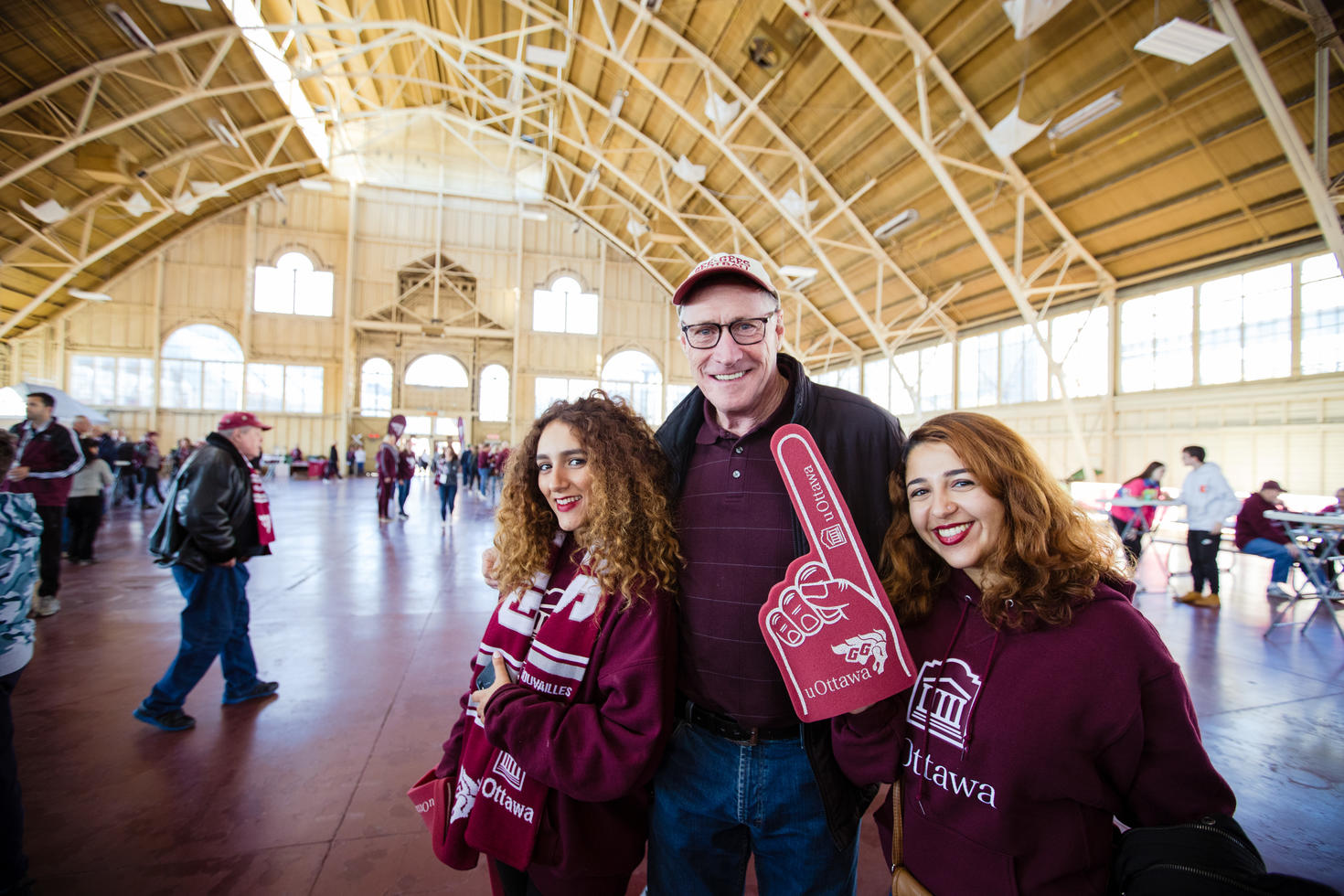 Group posing with Gee-Gees branded items.