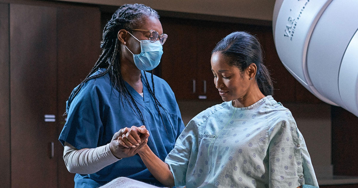 Black woman receiving cancer treatment