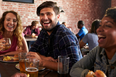 Group laughing at table