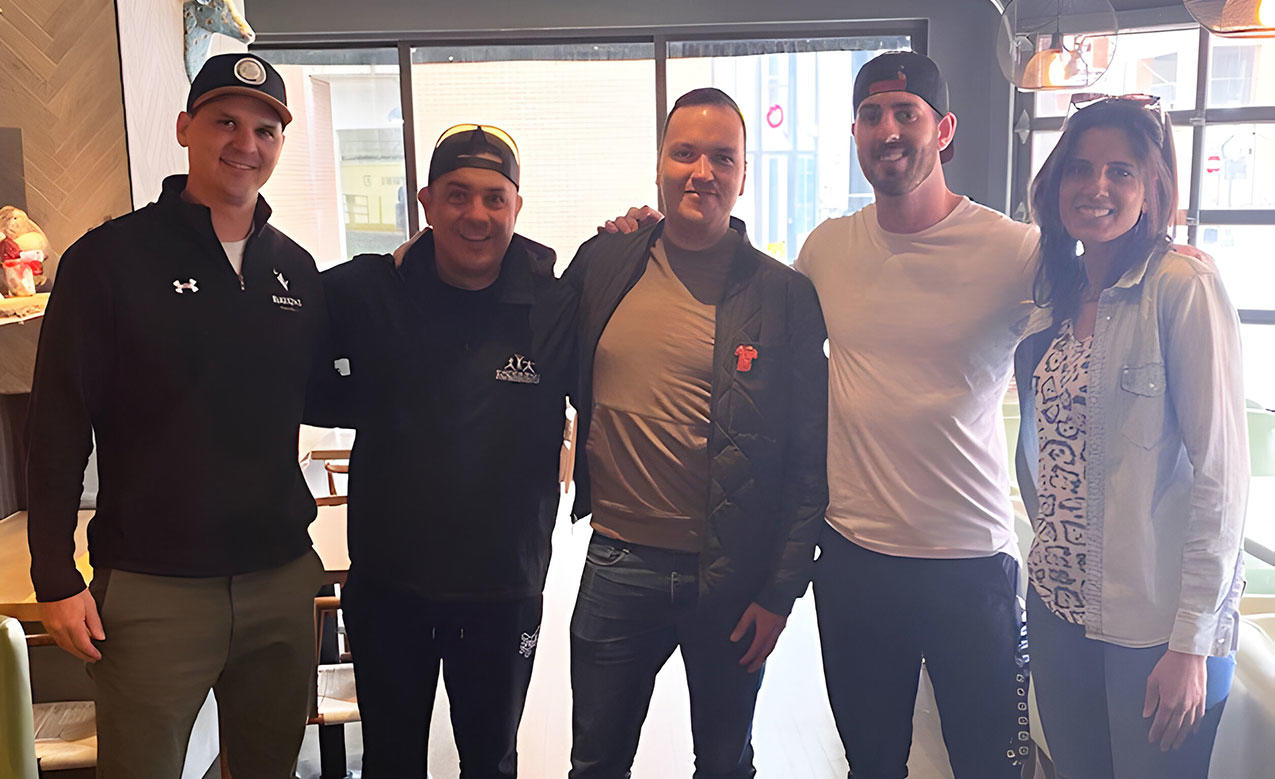 a group of 5 people standing side by side