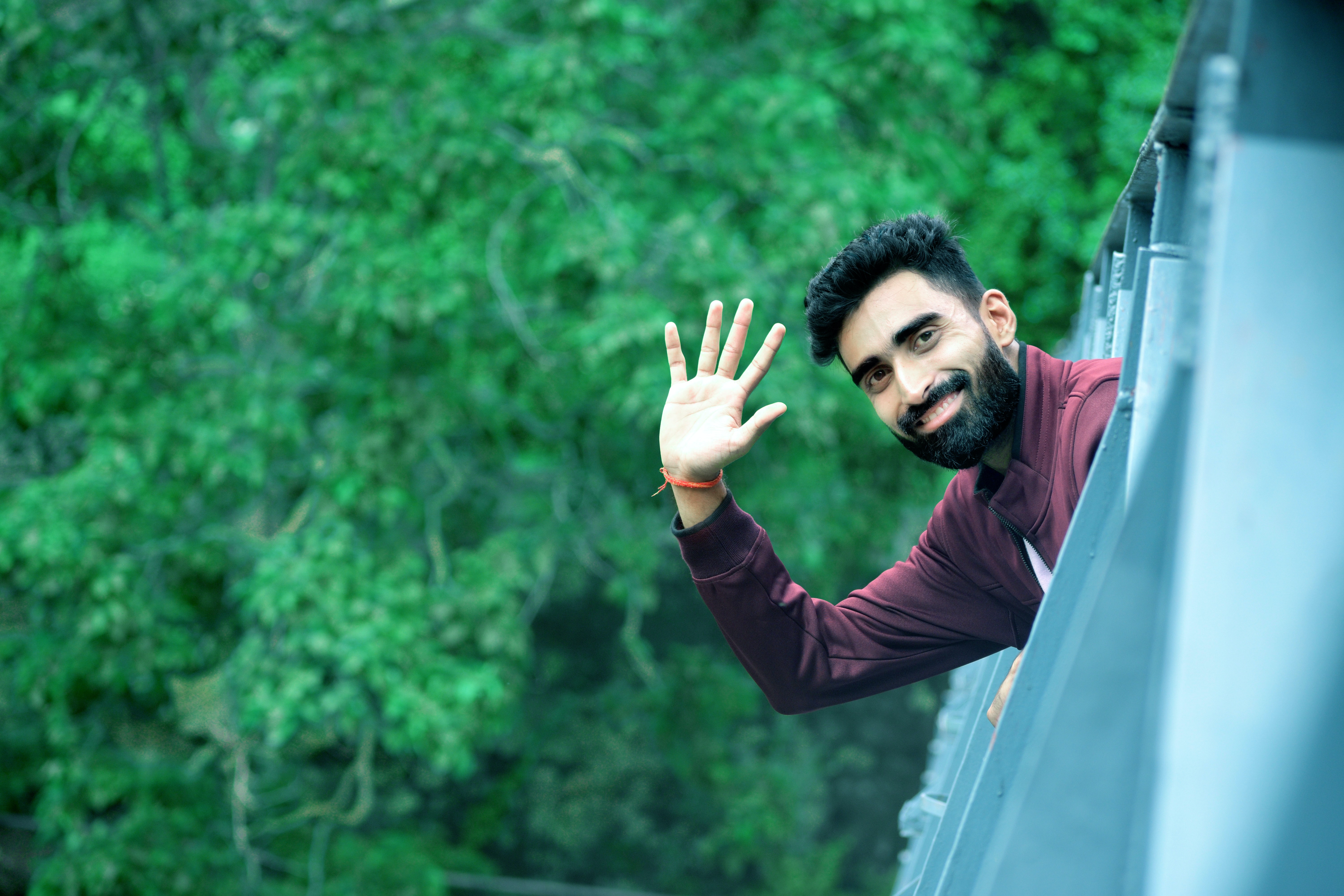 person waving hello