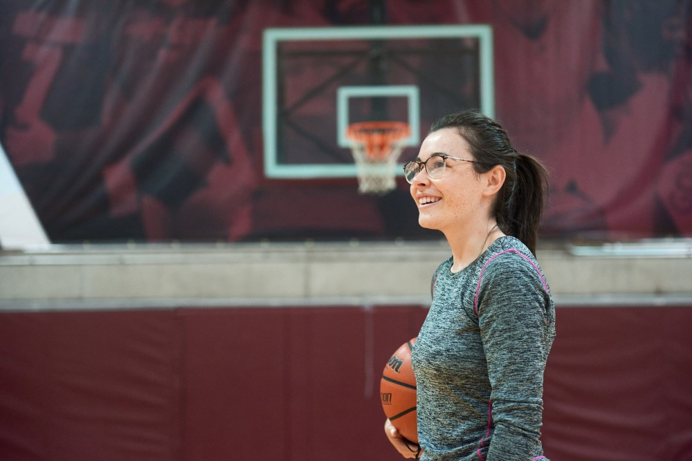 Women holding a basketball.