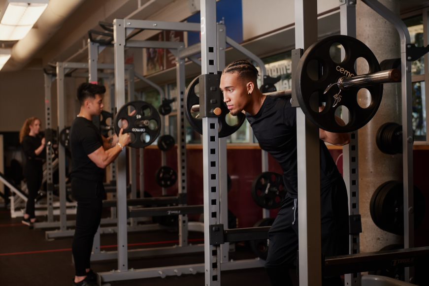 individual pushing weights