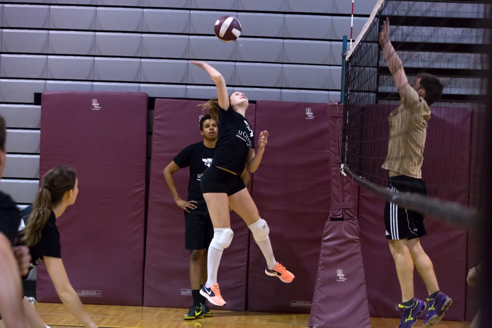 Person hitting a volleyball.