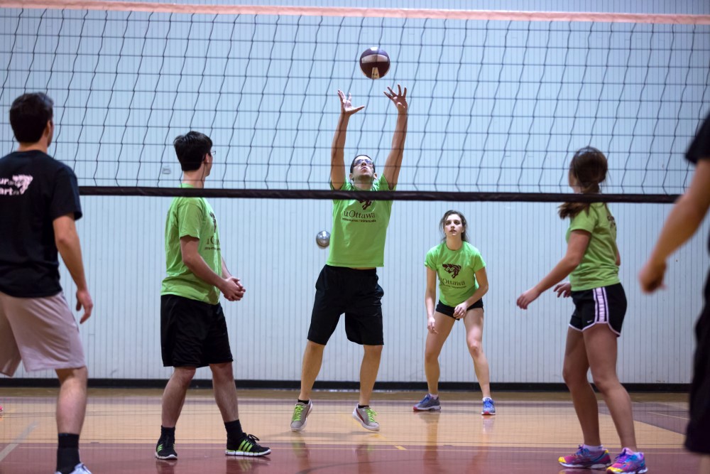 Person doing a pass while playing volleyball.