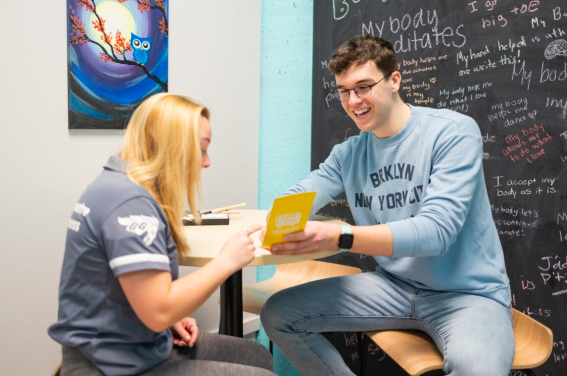 Student helping another