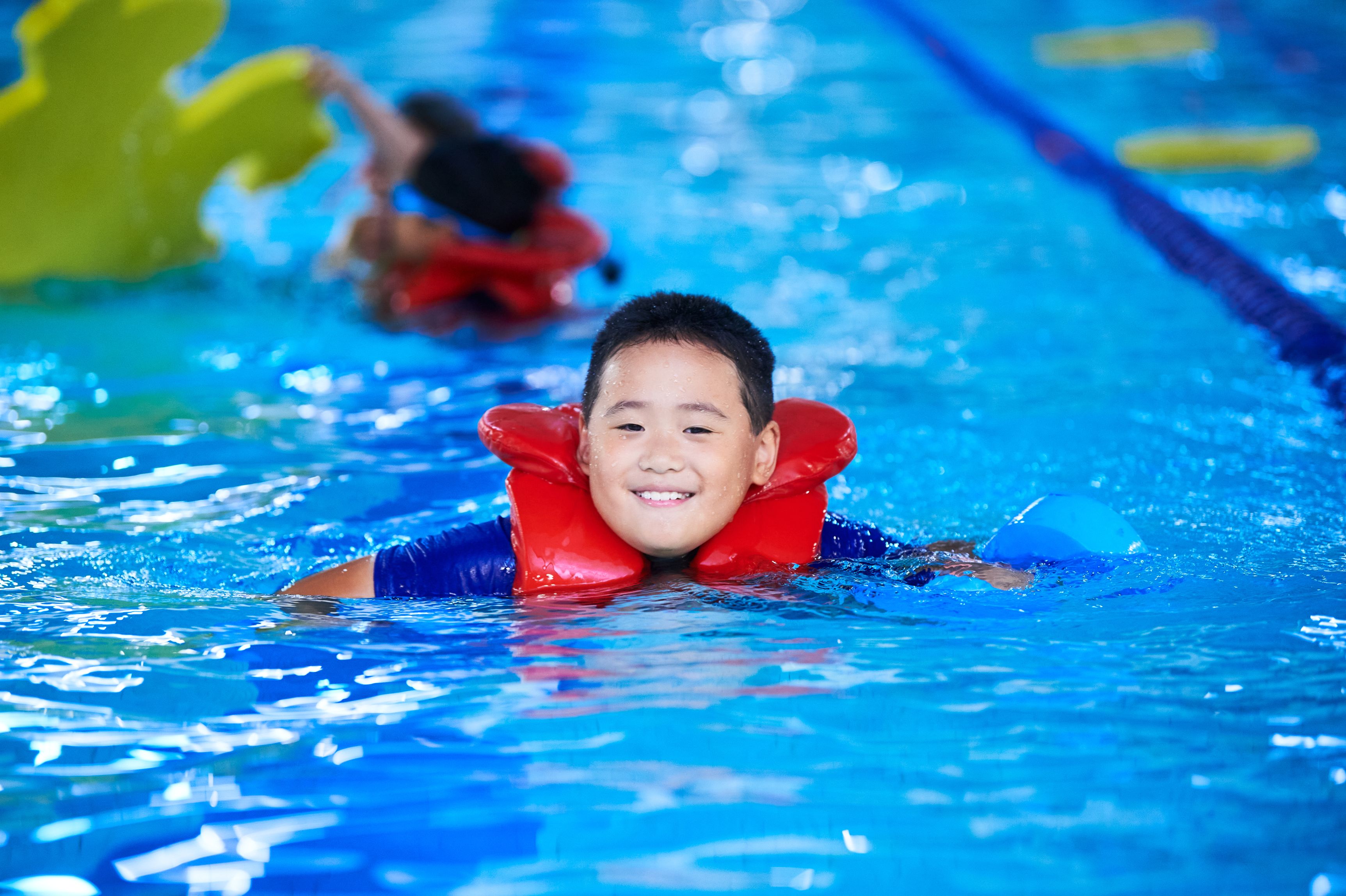 child in swimming pool