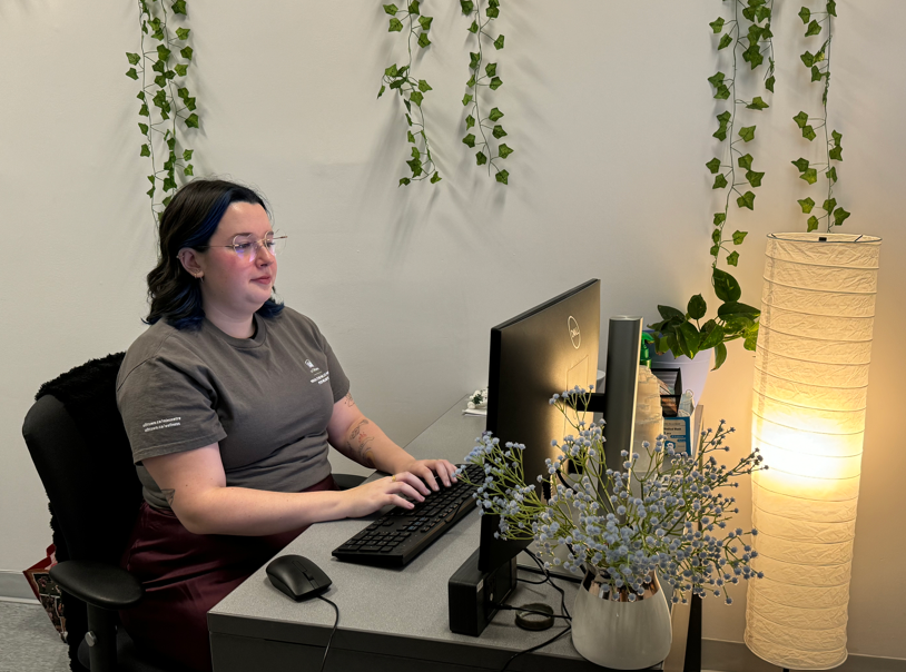 A peer working on a computer