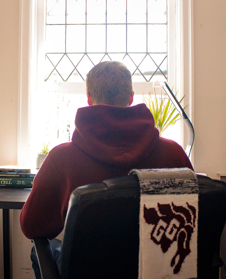 Back of a person with Gee-Gee scarf.