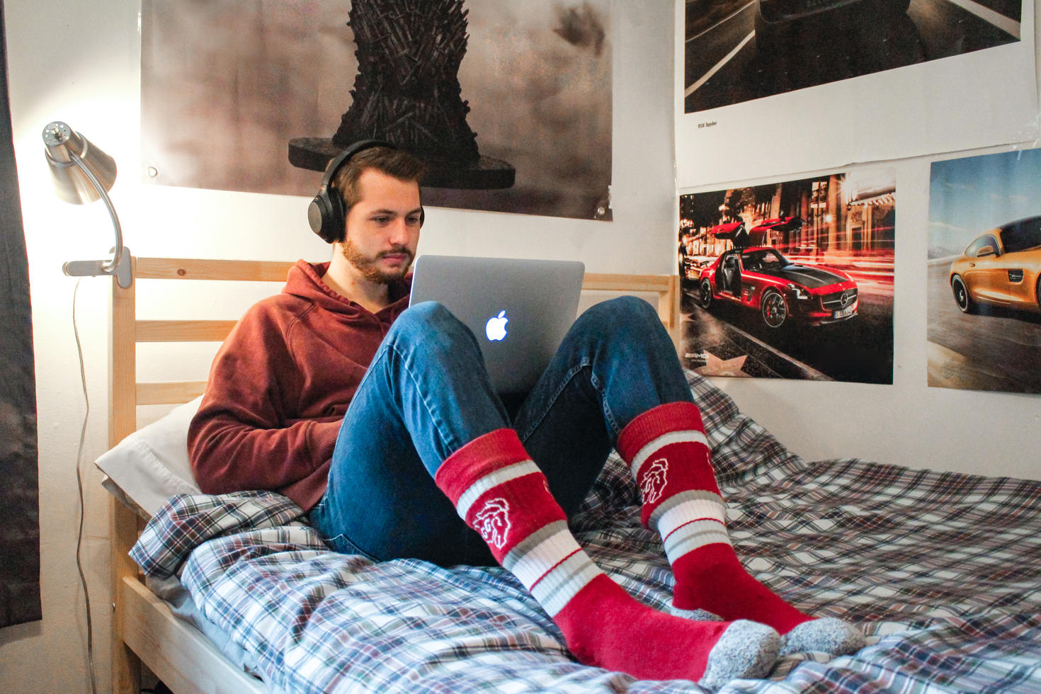 Student on his bed with a laptop