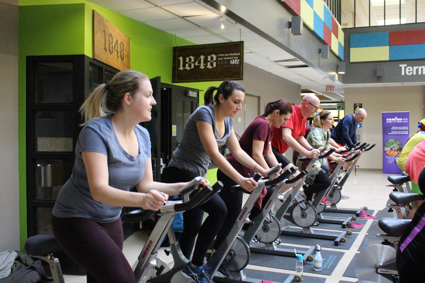 Employees on spin bikes