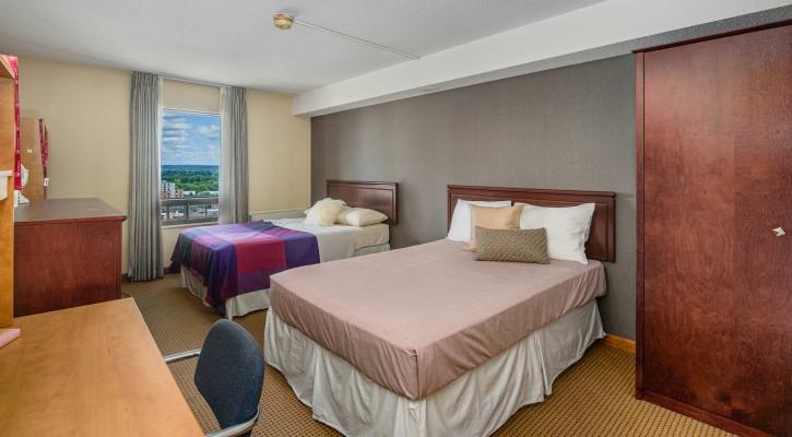 room inside rideau residence with two beds