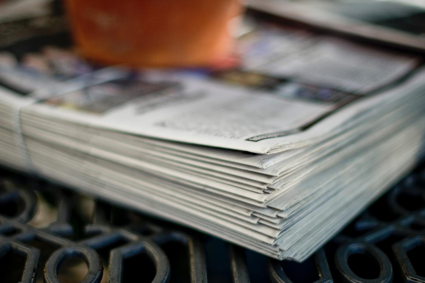 Newspapers stacked