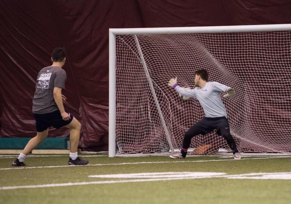 People playing soccer in the dome.