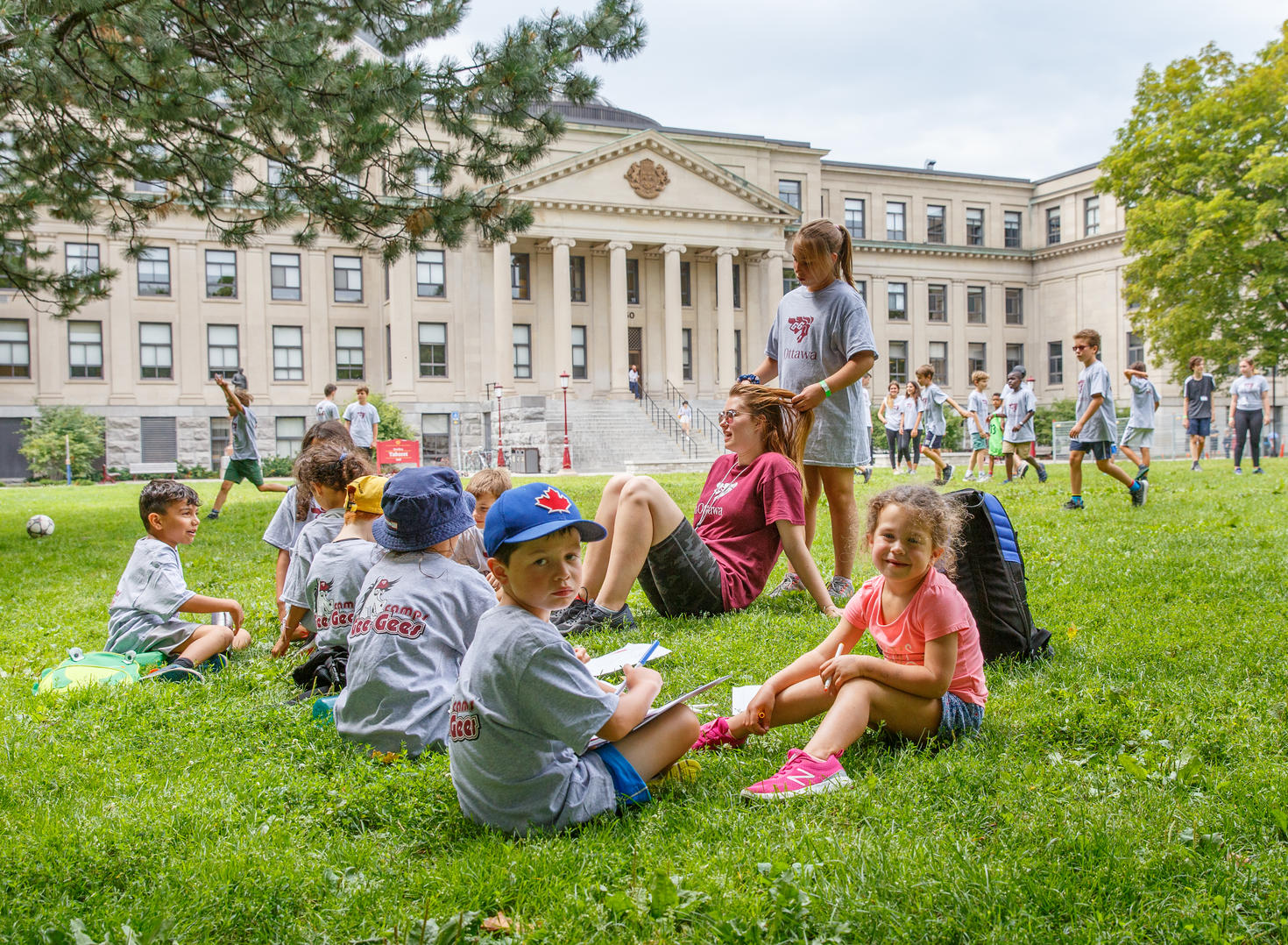 Campers sitting on Tabaret Lawn