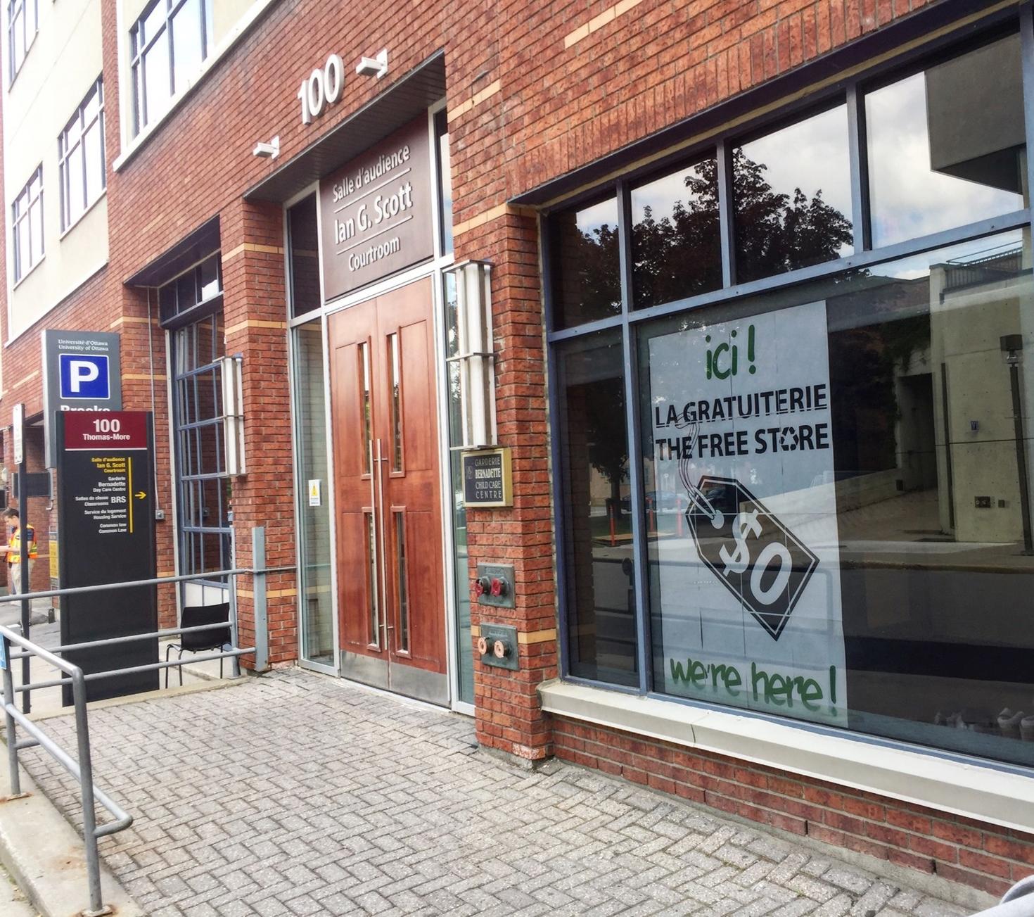 Building front on campus showing a sign for the Free Store in the window