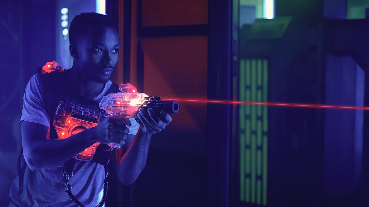 a guy pointing a laser