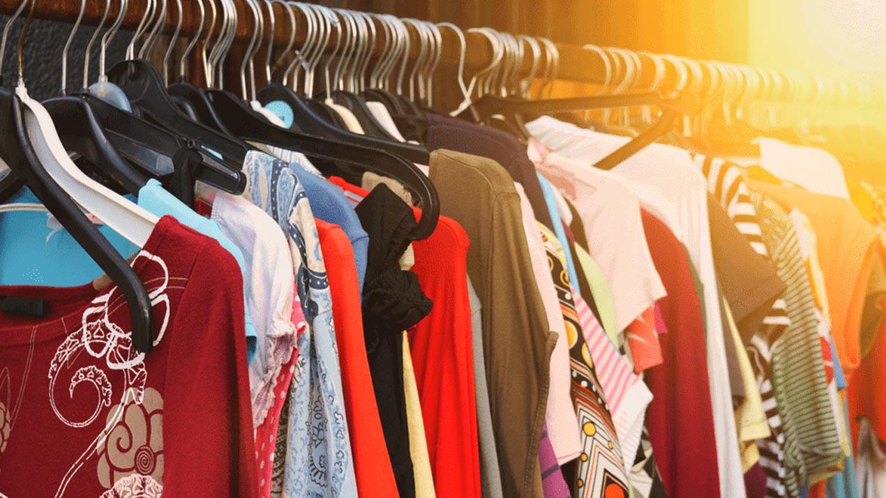 clothing on a rack from a thrift store
