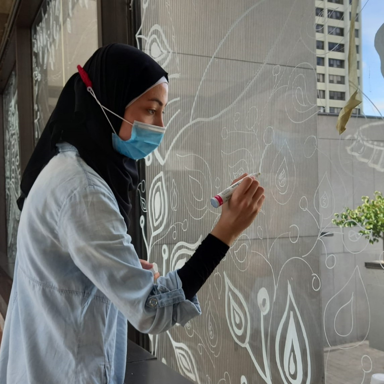 Student Drawing on a window