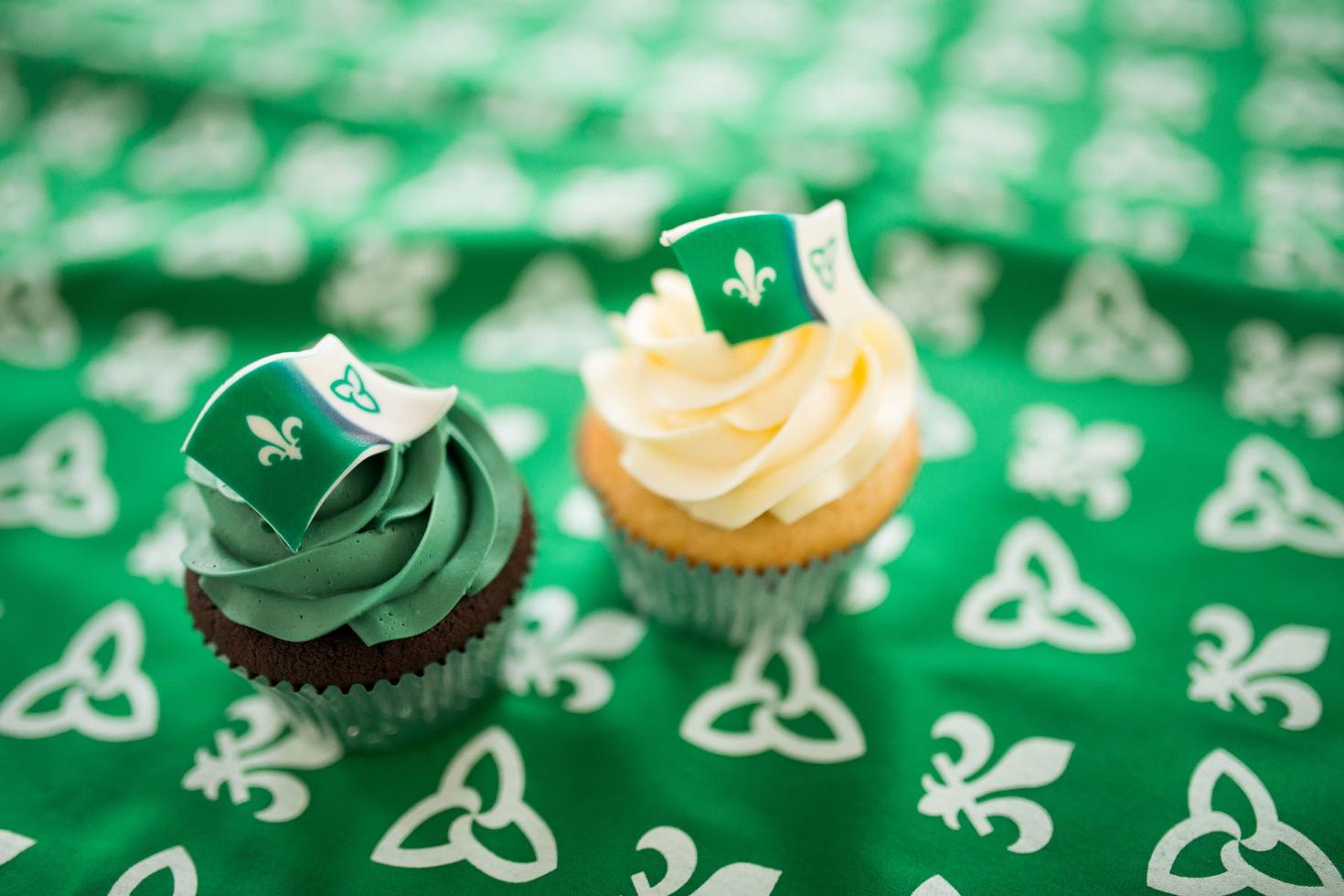 white and green cupcakes with franco-ontarian flags on them