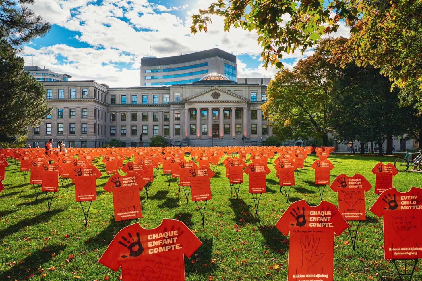 Orange shirts on Tabaret Lawn
