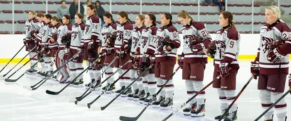 gee-gees women's hockey team line up on the blue line before a match