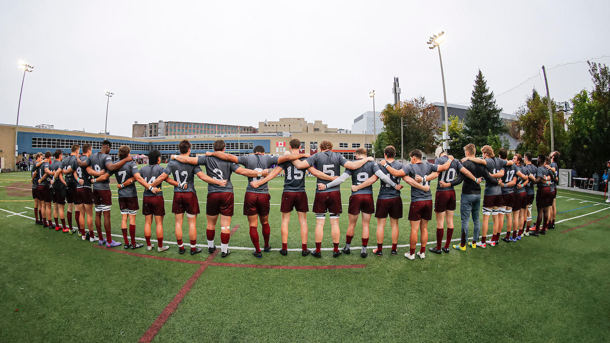 Gee-Gees rugby players standing
