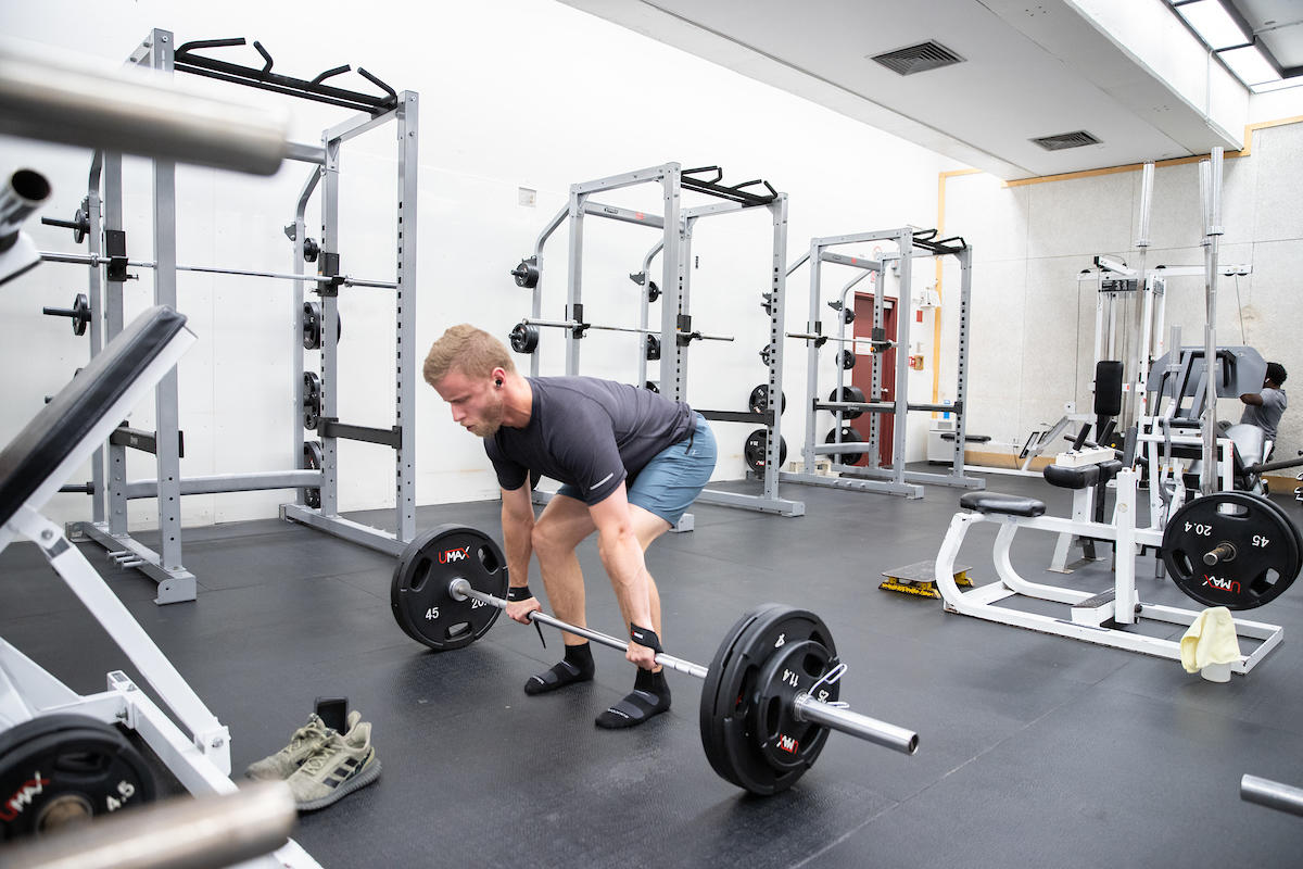 man lifting weights
