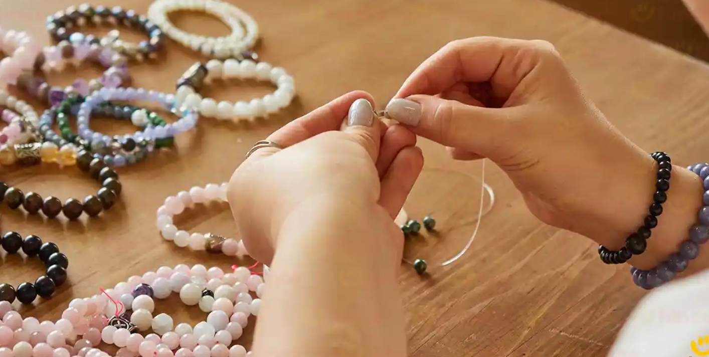 Hands and bracelets on a table