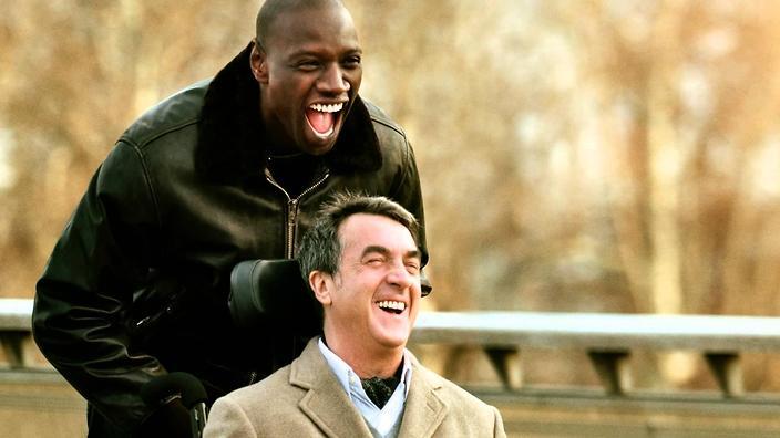 Two men smiling
