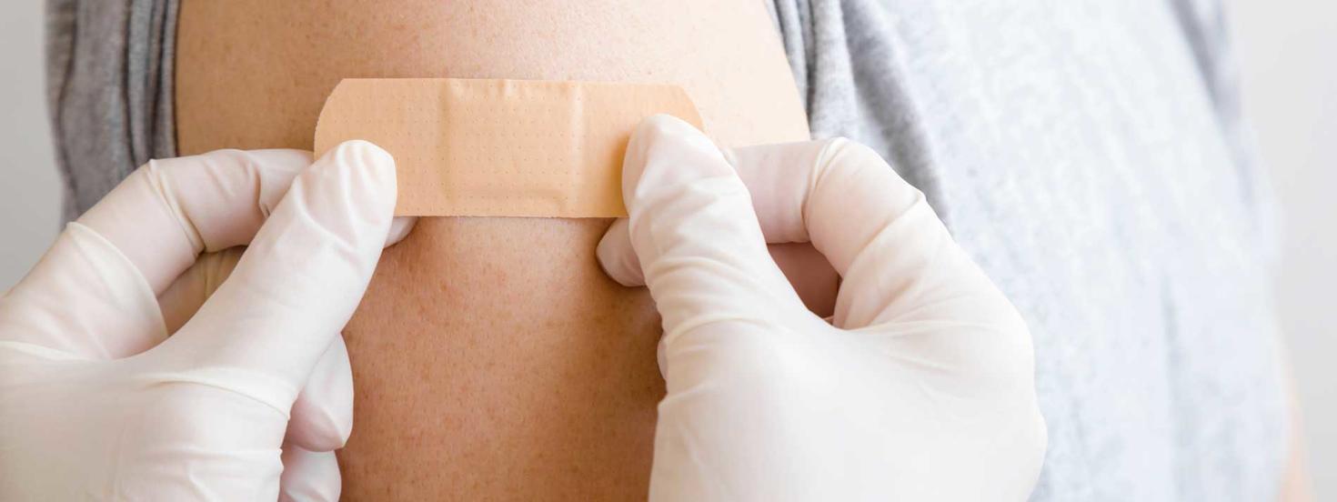 An arm with bandaid 