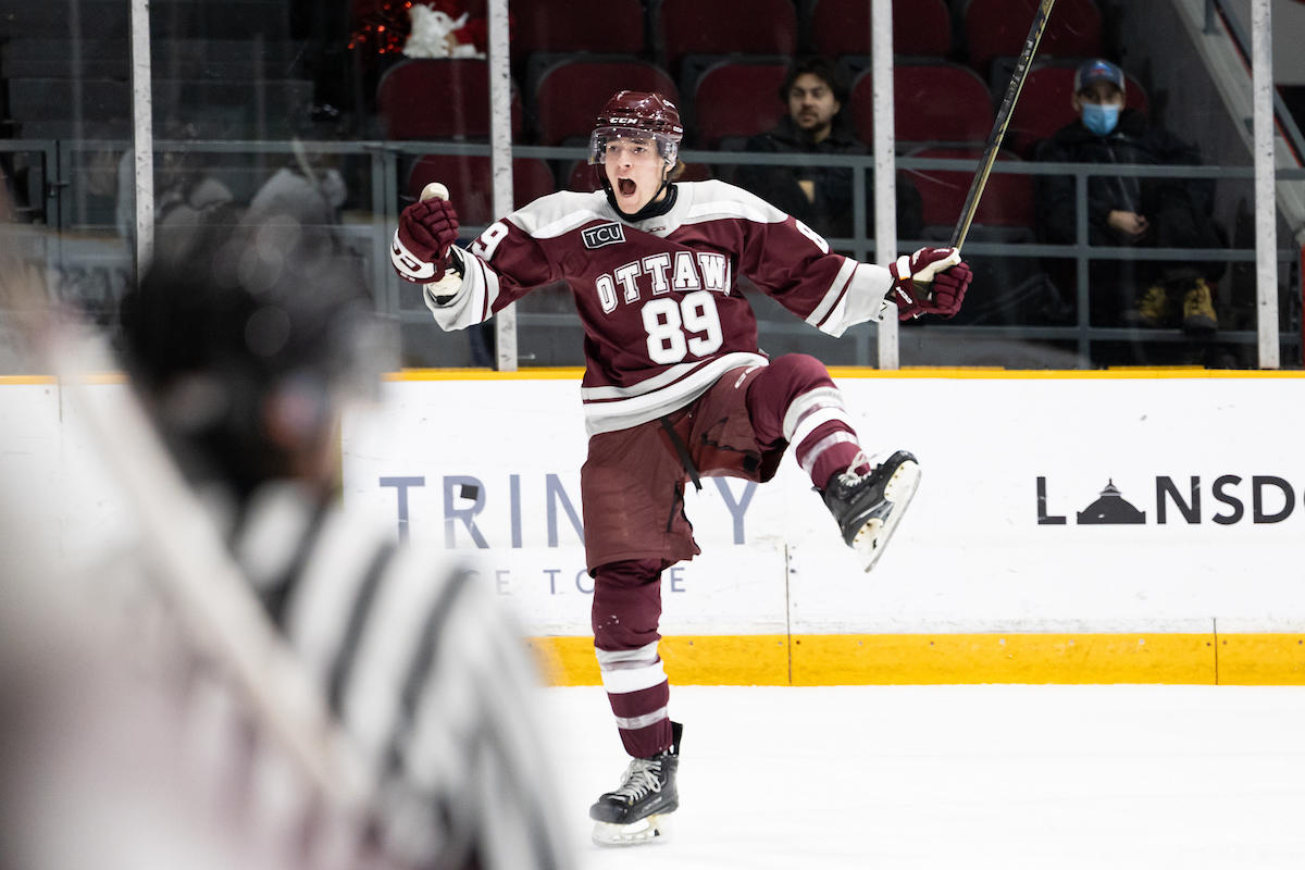 gee-gees hockey player cheering
