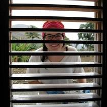 Carole-Ann behind a window