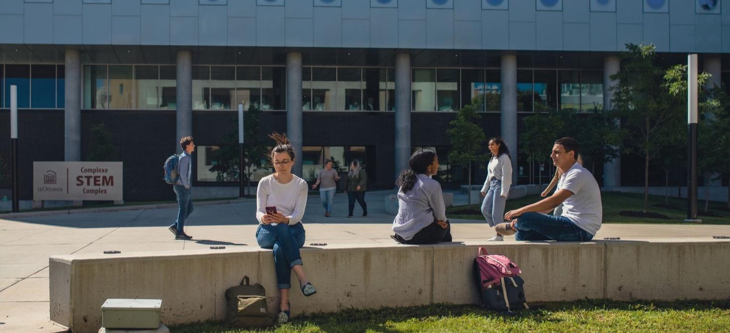 Students walking outside STEM complex