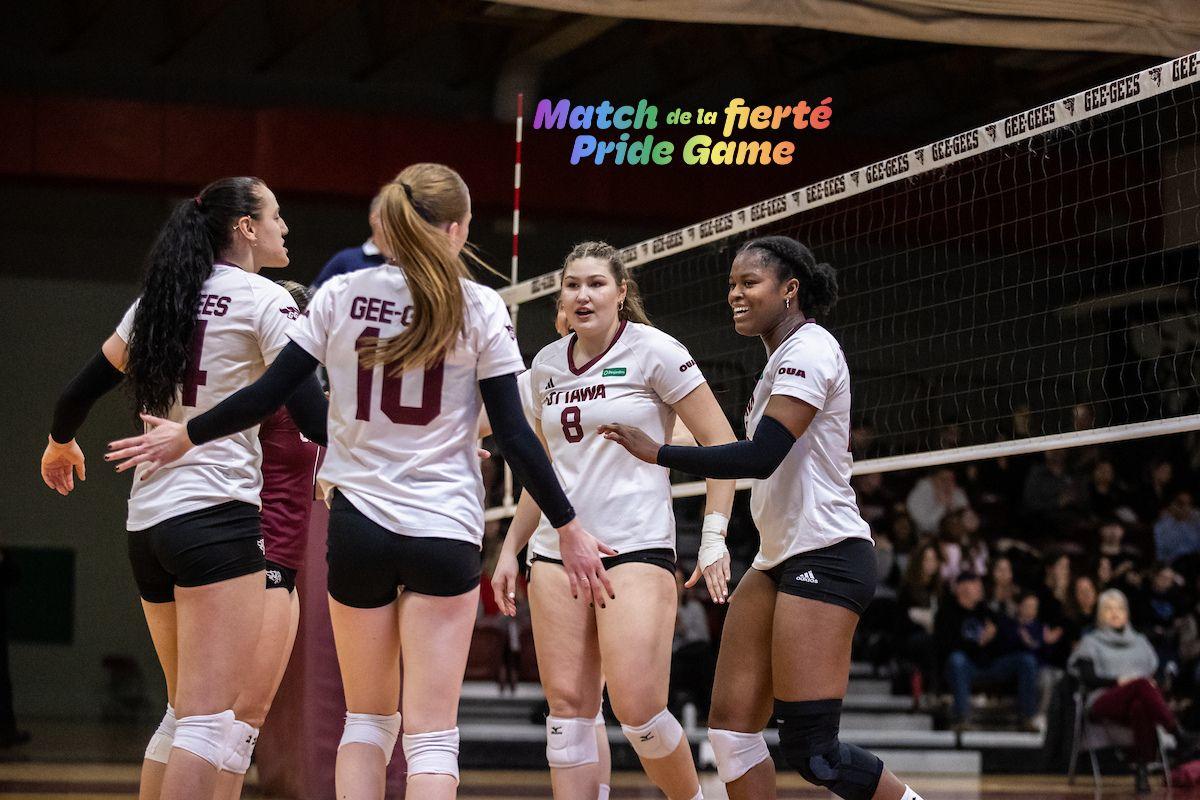 Four Gee-Gees Women's Volleyball players gather at the net